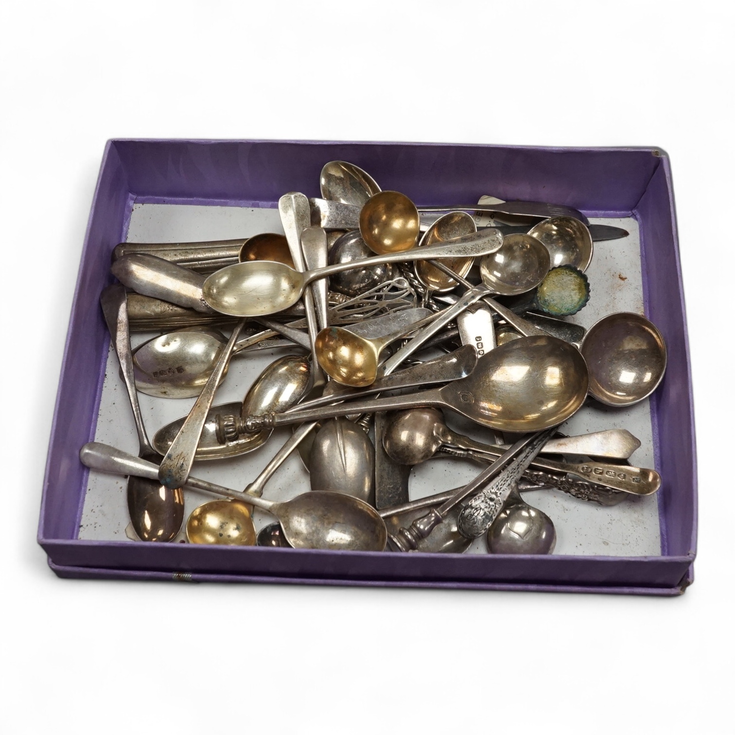 A small group of assorted 18th century and later silver flatware including teaspoons, condiment spoons, sugar tongs, etc. 9oz, together with two knives, one silver handled and nine silver plated items of flatware. Condit